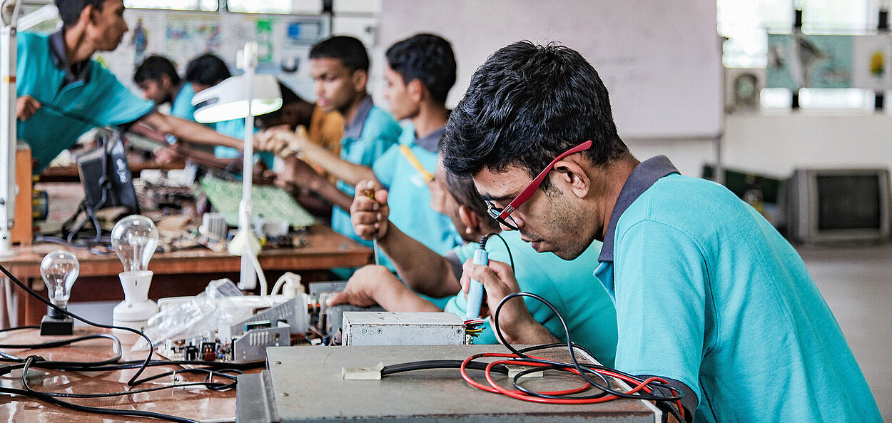 A young man from Sri Lanka works at a training center for people with disabilities.