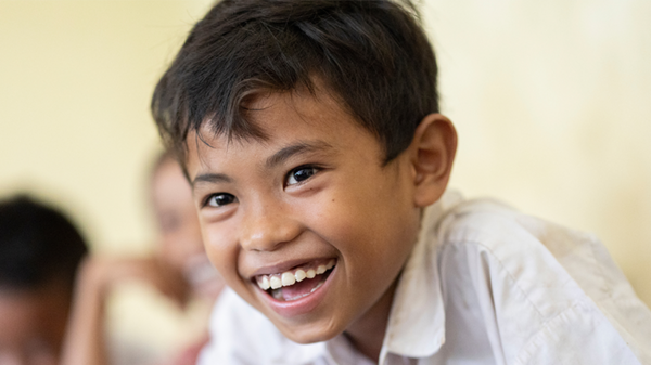 A boy from Cambodia in class.